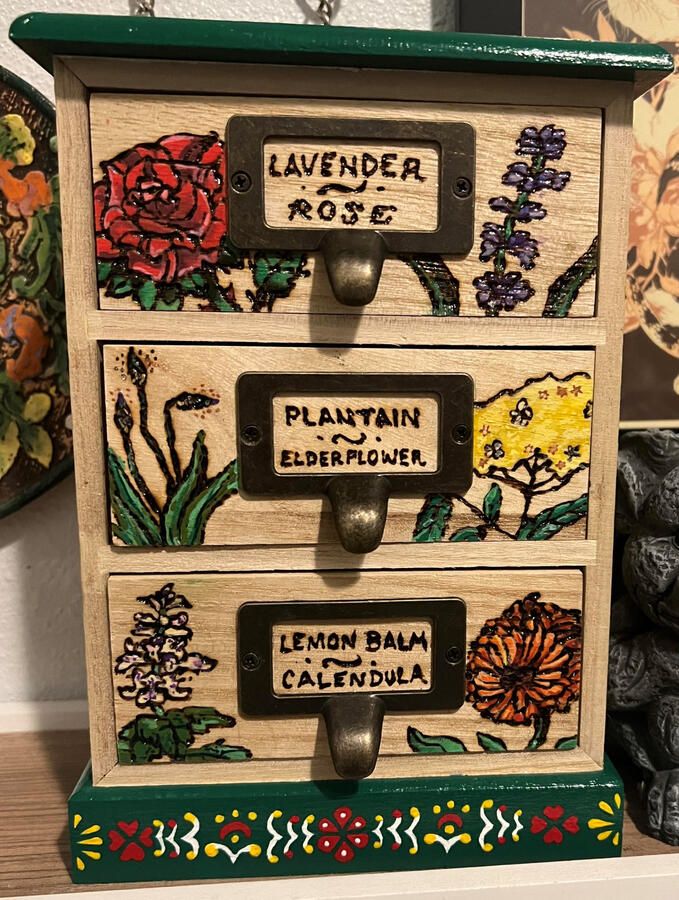 woodburned botanical illustration apothecary drawers with antique bronze apothecary drawer pulls handpainted with folk art pattern